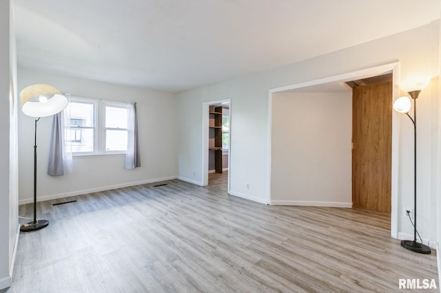1808 E 12th St, Davenport, IA 52803 - spare room with wood finished floors and baseboards