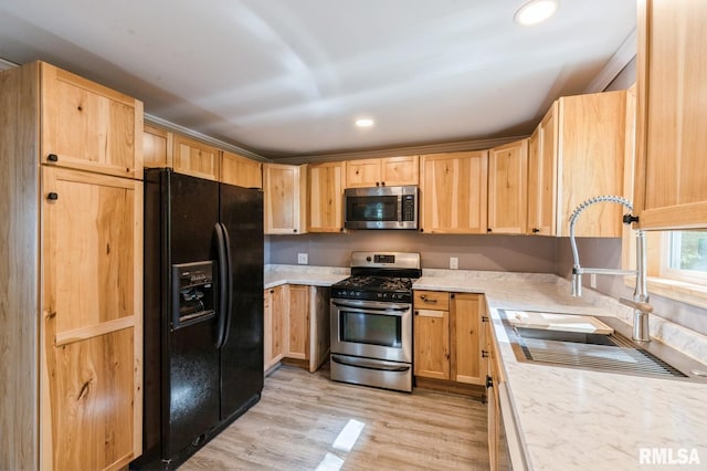 1808 E 12th St, Davenport, IA 52803 - kitchen with appliances with stainless steel finishes, light brown cabinets, light wood-type flooring, recessed lighting, and light stone countertops