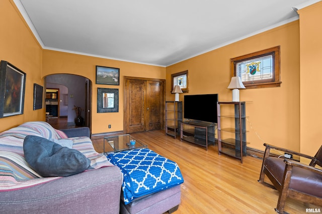 1632 18th Ave Unit 6, Rock Island, IL 61201 - living room featuring wood finished floors, arched walkways, and crown molding