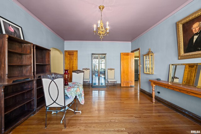 1632 18th Ave Unit 6, Rock Island, IL 61201 - sitting room featuring ornamental molding, a chandelier, wood finished floors, and arched walkways