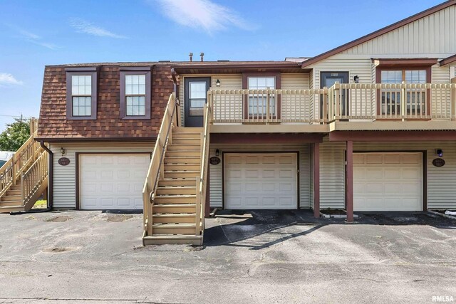 4011 Lillie Ave Unit 106, Davenport, IA 52806 - view of front of house featuring stairs and a garage