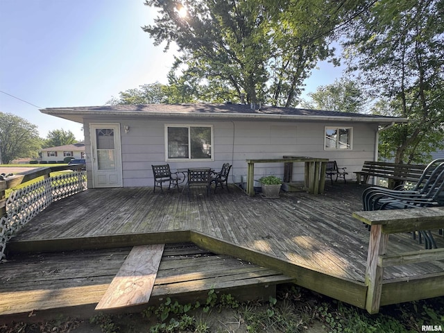 2938 Summit Hills Ct, Bettendorf, IA 52722 - wooden deck with outdoor dining area