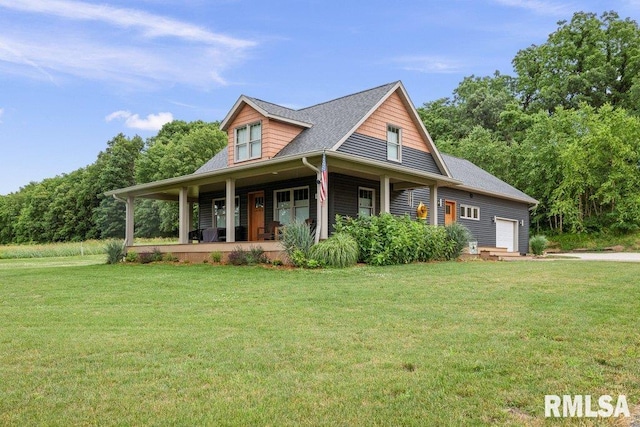 11815 Rte 84 N, Port Byron, IL 61275 - view of front facade featuring covered porch, a front lawn, and an attached garage