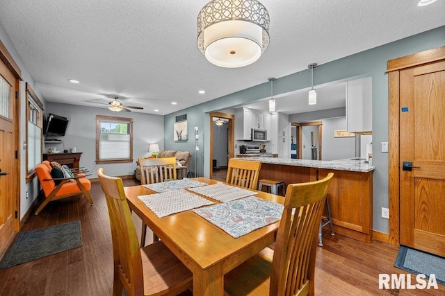 11815 Rte 84 N, Port Byron, IL 61275 - dining space featuring a textured ceiling, ceiling fan, wood finished floors, and recessed lighting