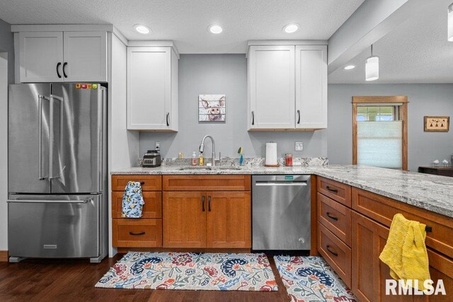 11815 Rte 84 N, Port Byron, IL 61275 - kitchen with appliances with stainless steel finishes, dark wood-style flooring, light stone countertops, white cabinets, and recessed lighting