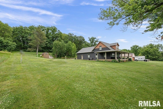11815 Rte 84 N, Port Byron, IL 61275 - view of front of property featuring a shed, a front yard, and a porch