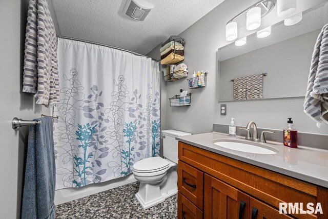 11815 Rte 84 N, Port Byron, IL 61275 - bathroom with vanity, a textured ceiling, and shower / tub combo