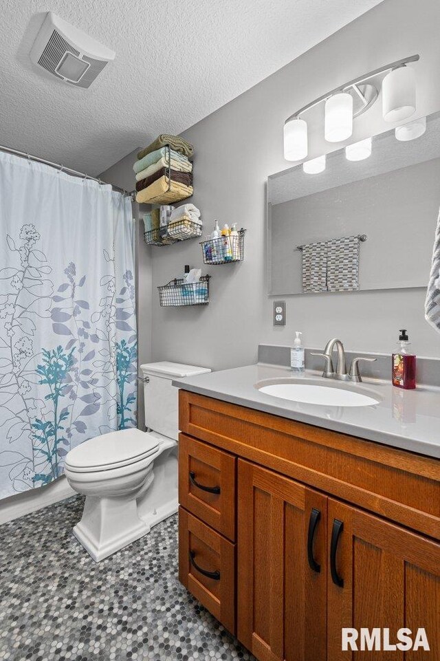 11815 Rte 84 N, Port Byron, IL 61275 - bathroom with vanity, a textured ceiling, and a shower with shower curtain