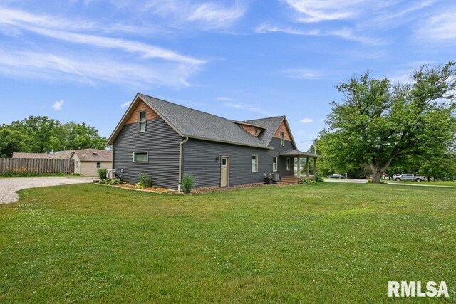 11815 Rte 84 N, Port Byron, IL 61275 - view of home's exterior featuring driveway and roof with shingles