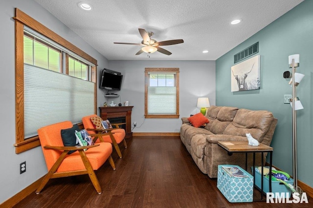 11815 Rte 84 N, Port Byron, IL 61275 - living area with wood finished floors, ceiling fan, a textured ceiling, a glass covered fireplace, and recessed lighting