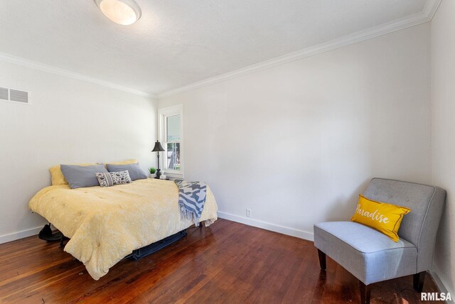 209 45th St, Moline, IL 61265 - bedroom featuring wood finished floors and ornamental molding