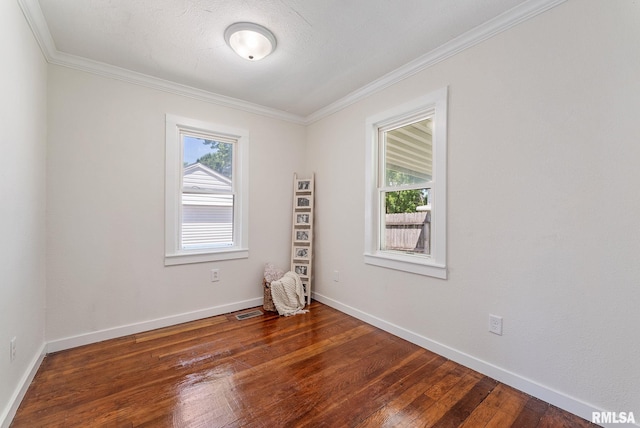 209 45th St, Moline, IL 61265 - spare room featuring healthy amount of natural light, crown molding, and hardwood / wood-style flooring