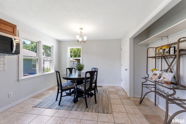 209 45th St, Moline, IL 61265 - dining area with a chandelier and light tile patterned flooring