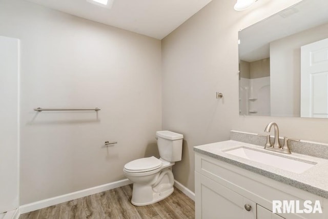 1231 Devils Glen Rd, Bettendorf, IA 52722 - full bath featuring wood finished floors, vanity, and a shower