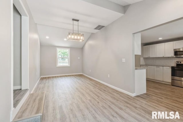 1231 Devils Glen Rd, Bettendorf, IA 52722 - unfurnished dining area featuring light wood finished floors, lofted ceiling, a chandelier, and recessed lighting