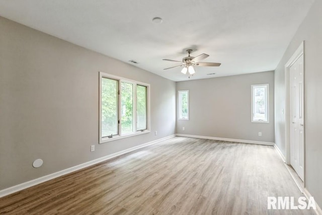 1231 Devils Glen Rd, Bettendorf, IA 52722 - unfurnished room featuring light wood finished floors and a ceiling fan