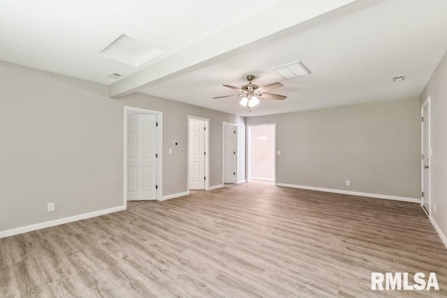 1231 Devils Glen Rd, Bettendorf, IA 52722 - unfurnished living room with light wood finished floors, attic access, and ceiling fan
