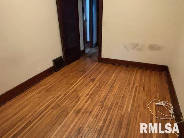 712 Roosevelt Ave, Kewanee, IL 61443 - unfurnished room featuring hardwood / wood-style flooring