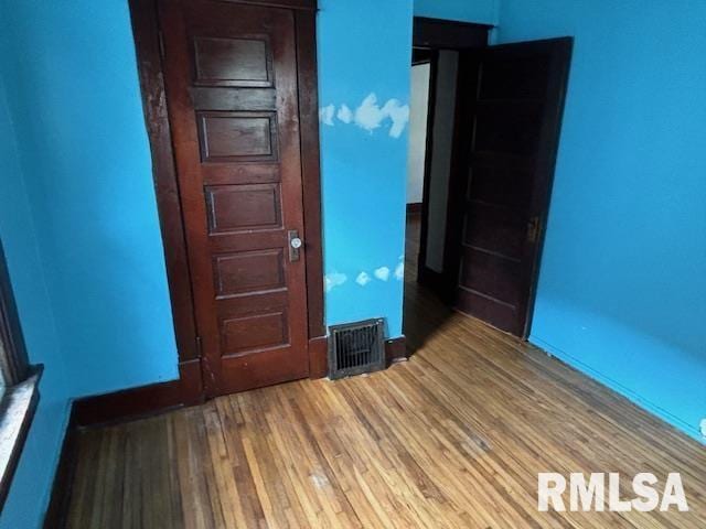 712 Roosevelt Ave, Kewanee, IL 61443 - unfurnished room featuring wood finished floors and baseboards