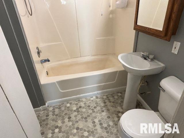 712 Roosevelt Ave, Kewanee, IL 61443 - bathroom featuring toilet and  shower combination