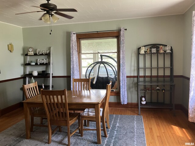 114 S State St, Annawan, IL 61234 - dining area featuring ornamental molding, hardwood / wood-style flooring, and a ceiling fan