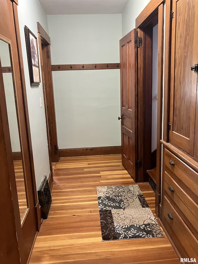 114 S State St, Annawan, IL 61234 - hall with light wood-style floors and baseboards