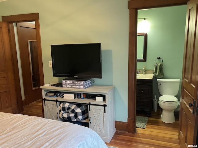 114 S State St, Annawan, IL 61234 - bedroom with wood finished floors and ensuite bathroom