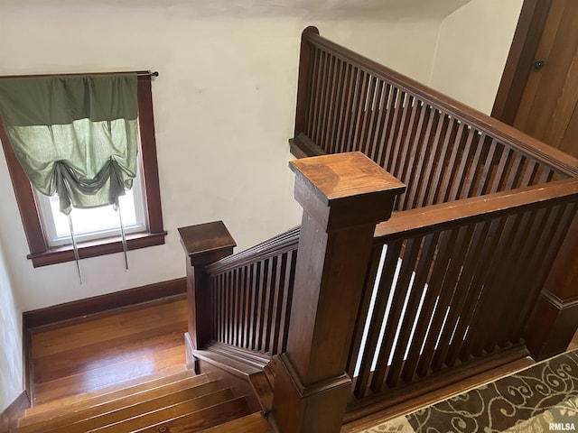 114 S State St, Annawan, IL 61234 - stairway featuring wood-type flooring and baseboards