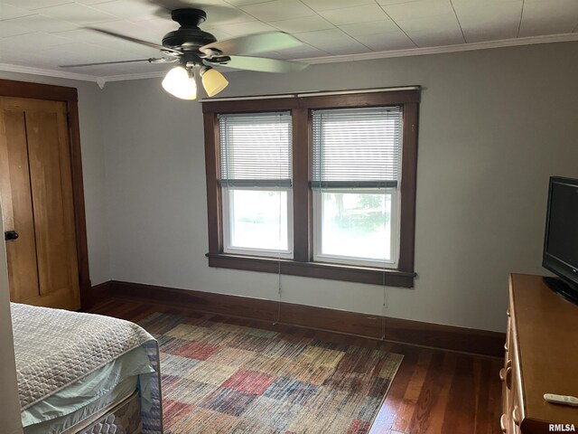 114 S State St, Annawan, IL 61234 - bedroom featuring dark wood-style flooring, ornamental molding, and a ceiling fan