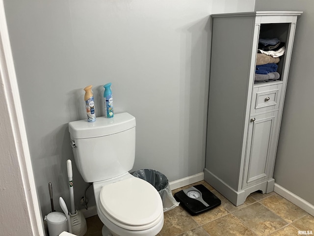 114 S State St, Annawan, IL 61234 - bathroom featuring baseboards and stone finish flooring