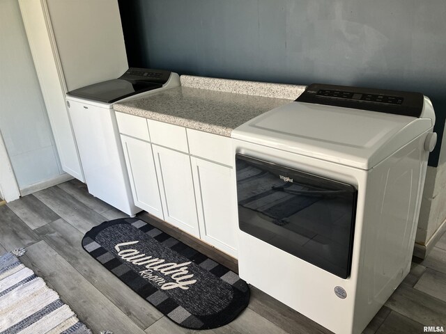 114 S State St, Annawan, IL 61234 - laundry room with wood finished floors, separate washer and dryer, and cabinet space