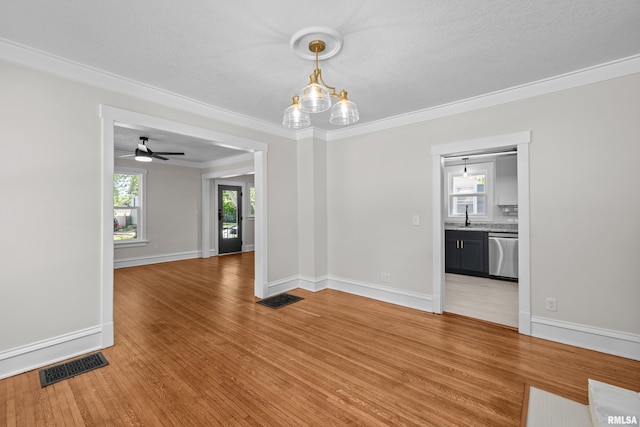 2664 Fair Ave, Davenport, IA 52803 - unfurnished room featuring light wood-type flooring, ceiling fan, and crown molding