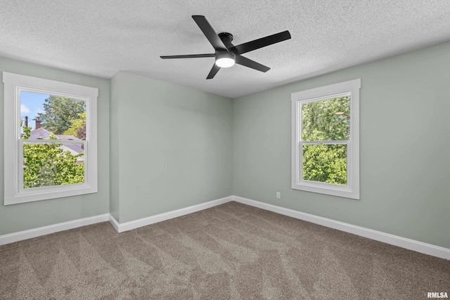 2664 Fair Ave, Davenport, IA 52803 - carpeted spare room with a textured ceiling, plenty of natural light, and a ceiling fan