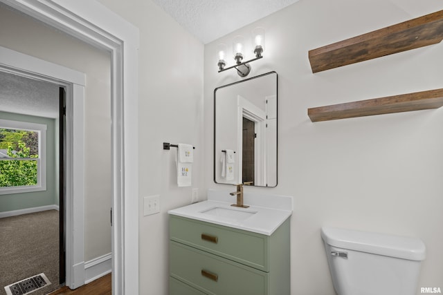 2664 Fair Ave, Davenport, IA 52803 - half bath with vanity and a textured ceiling