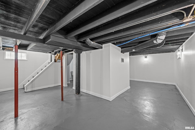 2664 Fair Ave, Davenport, IA 52803 - basement with stairway and baseboards