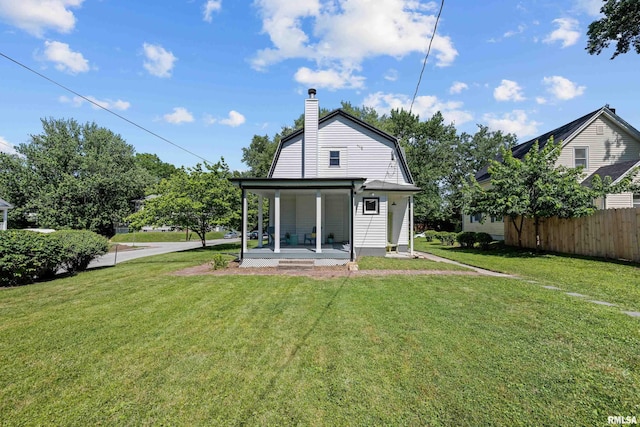 2664 Fair Ave, Davenport, IA 52803 - back of property with a gambrel roof, a chimney, and covered porch
