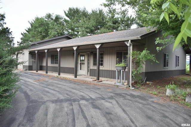 6899 Riverview Rd, Thomson, IL 61285 - view of front of property with covered porch and a shingled roof
