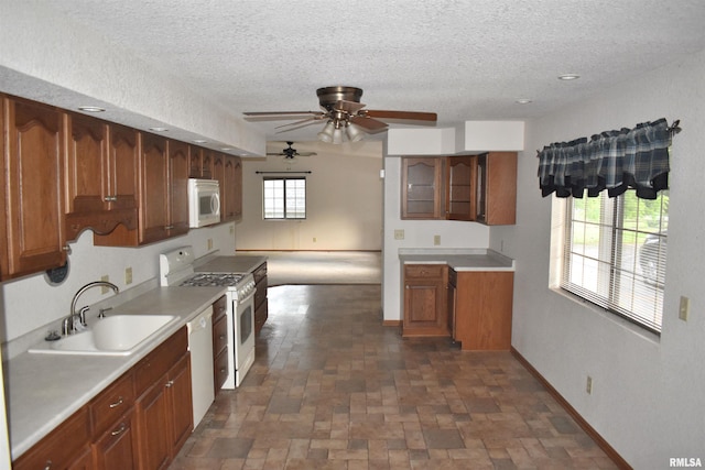 6899 Riverview Rd, Thomson, IL 61285 - kitchen featuring white appliances, ceiling fan, a textured ceiling, light countertops, and glass insert cabinets