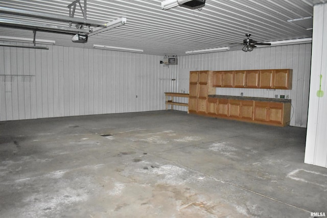 6899 Riverview Rd, Thomson, IL 61285 - garage featuring a garage door opener
