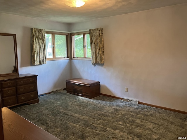 200 S Main St, Annawan, IL 61234 - bedroom with dark colored carpet and baseboards