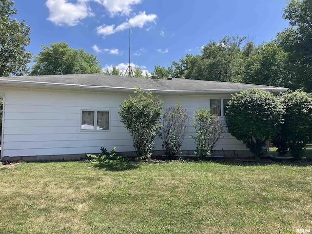 200 S Main St, Annawan, IL 61234 - view of side of property featuring a yard and roof with shingles