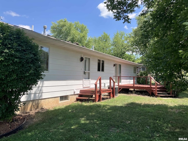 200 S Main St, Annawan, IL 61234 - back of property with a yard and a wooden deck