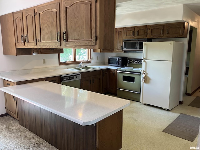 200 S Main St, Annawan, IL 61234 - kitchen with freestanding refrigerator, range with electric stovetop, dishwasher, and light countertops