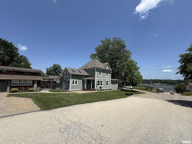 128 S 2nd St, Le Claire, IA 52753 - view of front of house featuring a front yard
