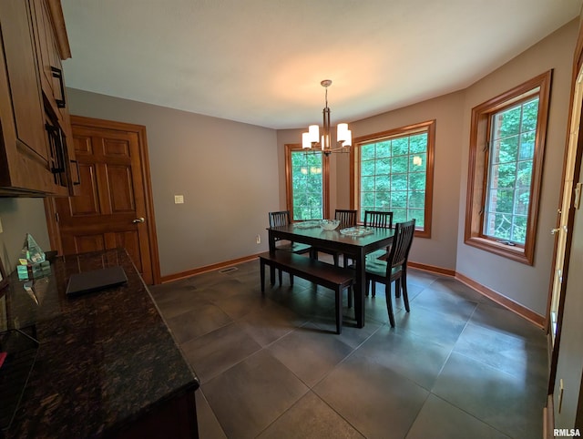 1315 W Wexford Pl, Peoria, IL 61615 - dining room with a chandelier and plenty of natural light
