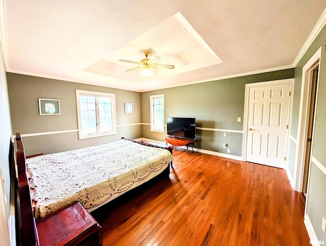 1315 W Wexford Pl, Peoria, IL 61615 - bedroom featuring a raised ceiling, wood finished floors, crown molding, and ceiling fan