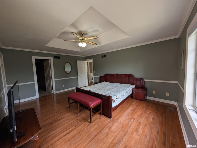 1315 W Wexford Pl, Peoria, IL 61615 - bedroom featuring a raised ceiling, light wood-style floors, ceiling fan, and ornamental molding