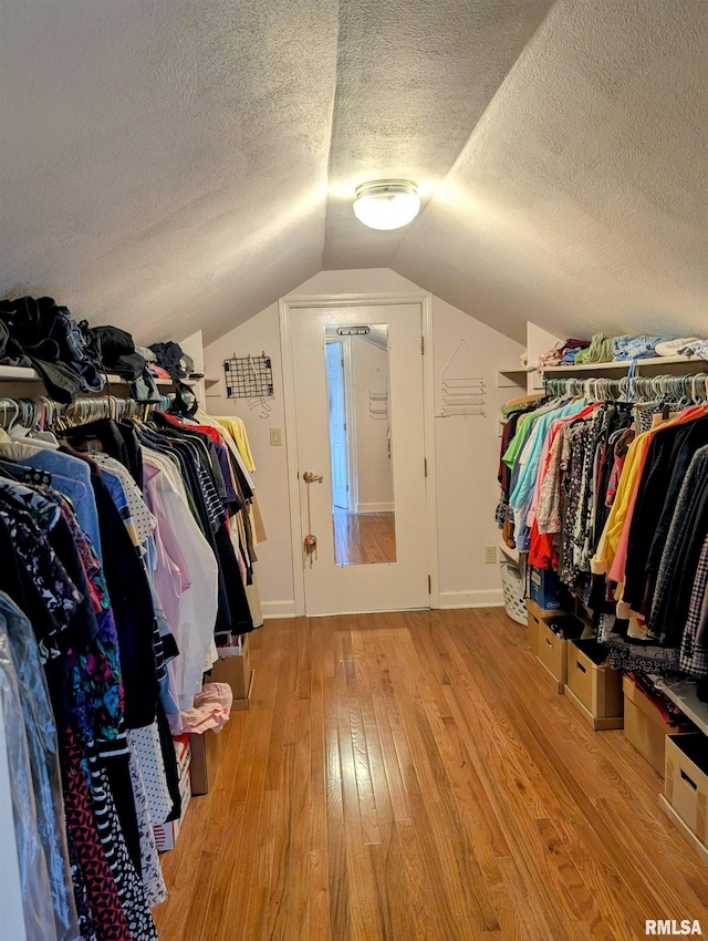 1315 W Wexford Pl, Peoria, IL 61615 - walk in closet featuring light wood-style floors and vaulted ceiling