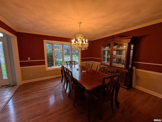 1315 W Wexford Pl, Peoria, IL 61615 - dining area featuring a chandelier, wood finished floors, and crown molding