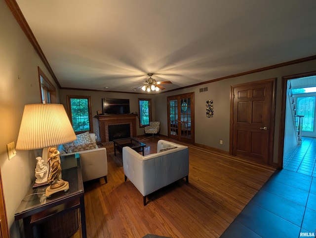 1315 W Wexford Pl, Peoria, IL 61615 - living room with a fireplace, ceiling fan, and ornamental molding